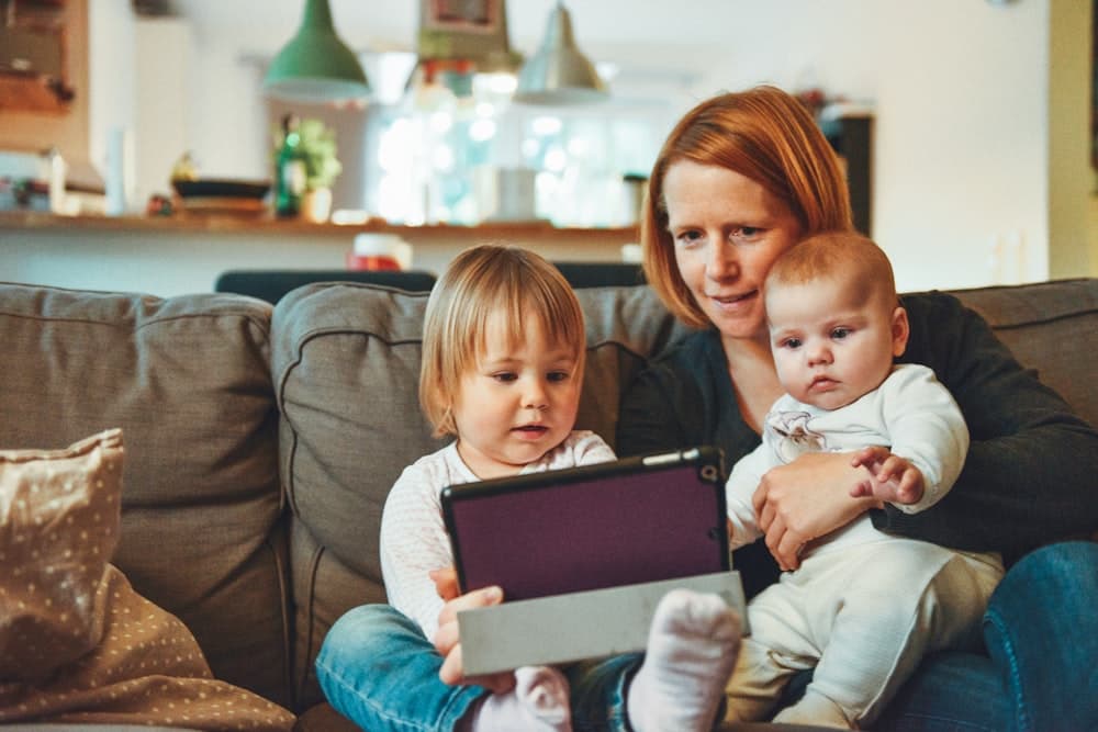 A mother at home with her two children